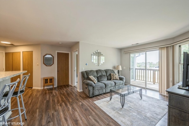 260 W Lynn Dr Unit 7-5B, Palatine, IL 60067 - living area featuring dark wood-style floors and baseboards
