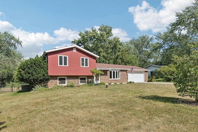 1020 Cassie Dr, Joliet, IL 60435 - tri-level home featuring an attached garage, brick siding, and driveway