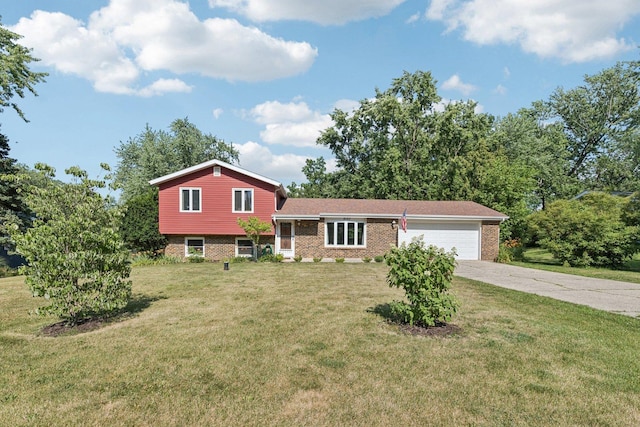 1020 Cassie Dr, Joliet, IL 60435 - split level home featuring brick siding, a garage, concrete driveway, and a front lawn