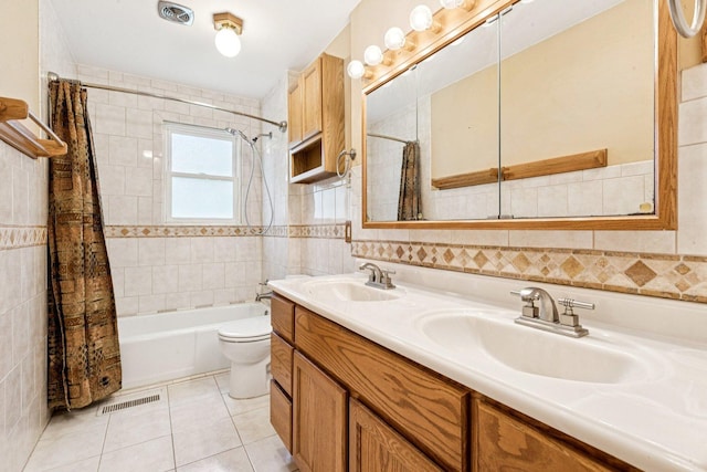 1020 Cassie Dr, Joliet, IL 60435 - bathroom featuring tile walls, shower / bath combo, double vanity, and tile patterned floors