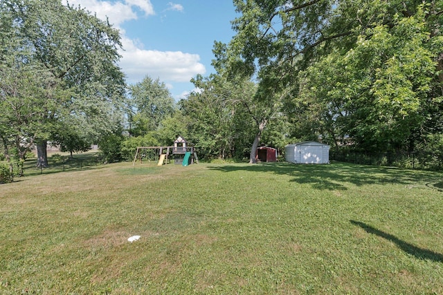 1020 Cassie Dr, Joliet, IL 60435 - view of yard with a storage shed and a playground
