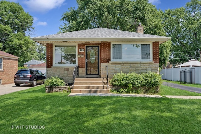 463 N Elm St, Hillside, IL 60162 - bungalow with stone siding, a chimney, and roof with shingles