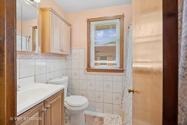 463 N Elm St, Hillside, IL 60162 - bathroom featuring vanity, tile walls, wainscoting, and tile patterned flooring