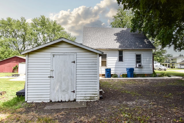 222 W S St, Dwight, IL 60420 - back of property featuring a storage unit, roof with shingles, and cooling unit
