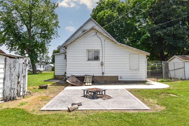 222 W S St, Dwight, IL 60420 - back of property featuring a fire pit, a patio area, and a shed