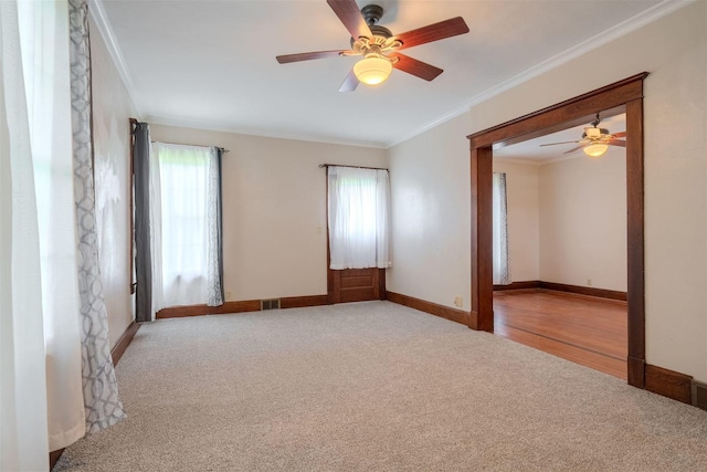 15313 Furrow Rd, Pekin, IL 61554 - carpeted empty room featuring healthy amount of natural light, crown molding, and a ceiling fan