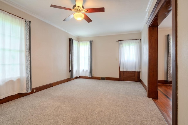 15313 Furrow Rd, Pekin, IL 61554 - empty room featuring crown molding, ceiling fan, and light carpet