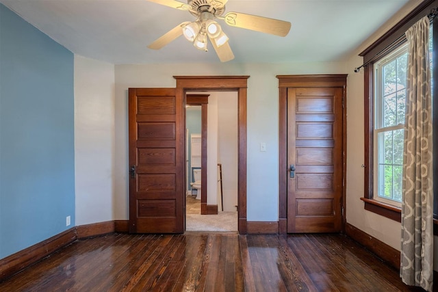 15313 Furrow Rd, Pekin, IL 61554 - unfurnished bedroom featuring wood-type flooring, multiple windows, and ceiling fan