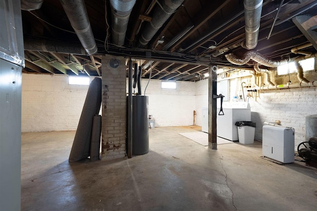 15313 Furrow Rd, Pekin, IL 61554 - below grade area featuring water heater, washer / dryer, and healthy amount of natural light