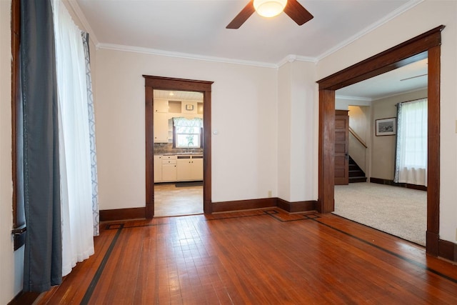 15313 Furrow Rd, Pekin, IL 61554 - spare room featuring ceiling fan, stairway, crown molding, and wood-type flooring