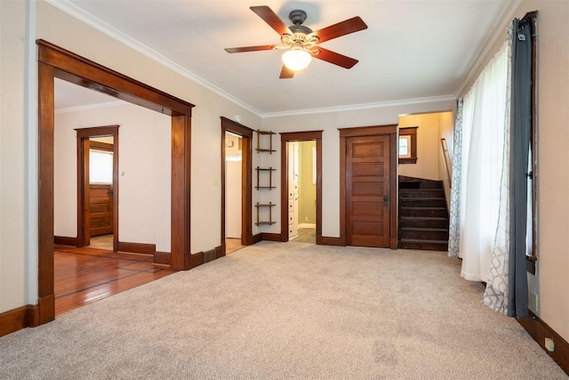 15313 Furrow Rd, Pekin, IL 61554 - unfurnished bedroom featuring carpet flooring, multiple windows, crown molding, ensuite bath, and ceiling fan