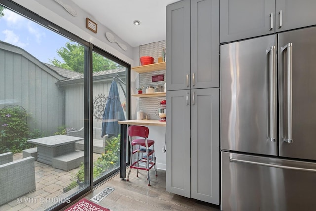 436 Shoreline Rd, Lake Barrington, IL 60010 - kitchen with high end fridge, open shelves, light wood finished floors, gray cabinetry, and recessed lighting