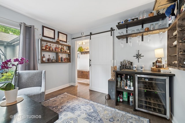 436 Shoreline Rd, Lake Barrington, IL 60010 - office area featuring wine cooler, a barn door, a dry bar, and wood finished floors