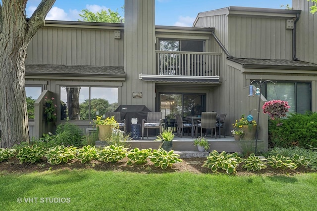 436 Shoreline Rd, Lake Barrington, IL 60010 - rear view of property with a balcony, a patio area, a yard, and a chimney