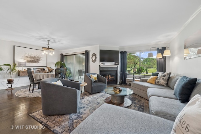 436 Shoreline Rd, Lake Barrington, IL 60010 - living room with a chandelier, wood finished floors, crown molding, and a glass covered fireplace