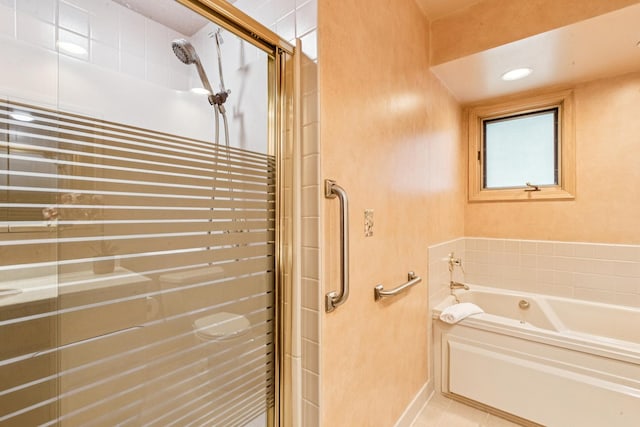 205 Sherwood Rd, Elgin, IL 60120 - full bath featuring a shower stall, a bath, and tile patterned floors