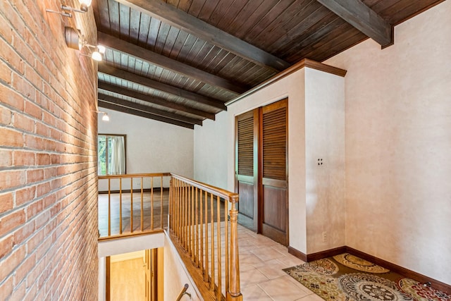 205 Sherwood Rd, Elgin, IL 60120 - corridor with an upstairs landing, light tile patterned floors, wooden ceiling, and brick wall