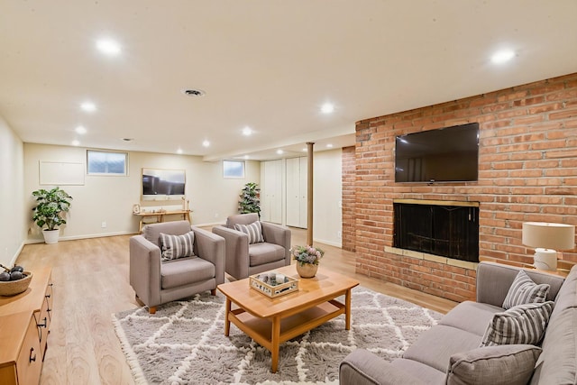 205 Sherwood Rd, Elgin, IL 60120 - living area featuring light wood-style flooring, a brick fireplace, and recessed lighting