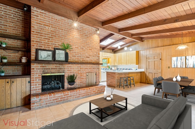 205 Sherwood Rd, Elgin, IL 60120 - living area featuring wood ceiling, light tile patterned floors, wooden walls, a fireplace, and plenty of natural light