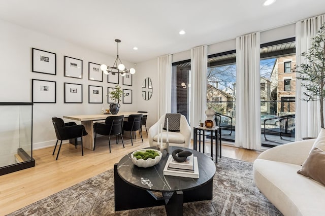 1423 W Huron St Unit 1, Chicago, IL 60642 - living area featuring wood finished floors, a chandelier, and recessed lighting