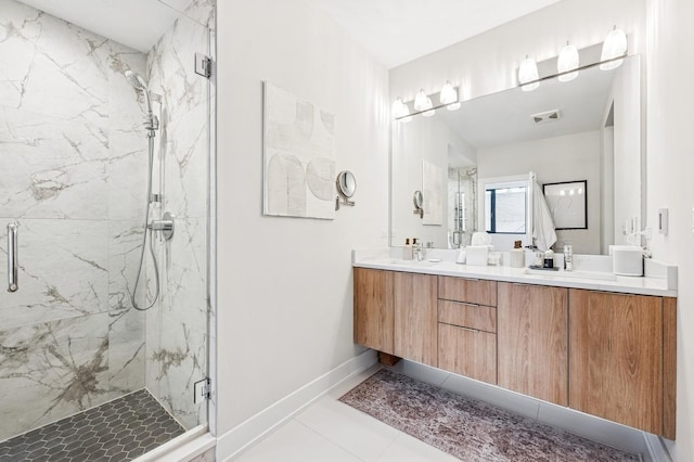 1423 W Huron St Unit 1, Chicago, IL 60642 - bathroom featuring a marble finish shower, double vanity, and tile patterned floors