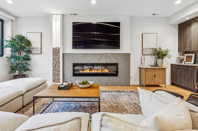 1423 W Huron St Unit 1, Chicago, IL 60642 - living room with a premium fireplace, light wood-style flooring, and recessed lighting