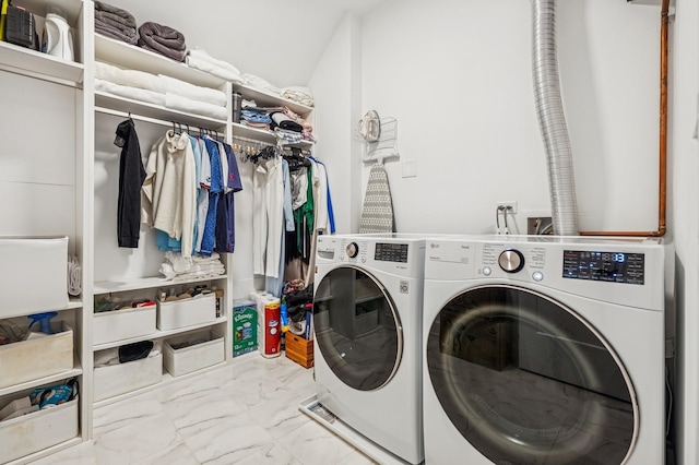 1423 W Huron St Unit 1, Chicago, IL 60642 - laundry area with marble finish flooring and independent washer and dryer