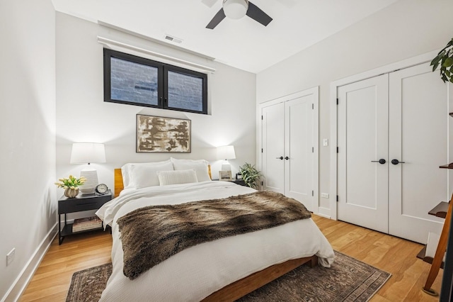 1423 W Huron St Unit 1, Chicago, IL 60642 - bedroom featuring two closets, light wood-style floors, and a ceiling fan