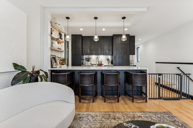 1423 W Huron St Unit 1, Chicago, IL 60642 - bar area featuring light wood-type flooring, decorative light fixtures, and recessed lighting