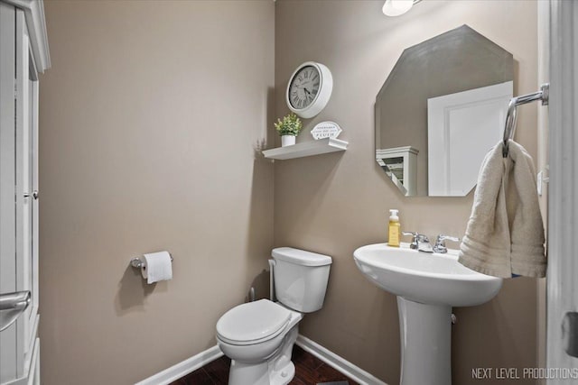 2267 Lundquist Dr, Aurora, IL 60503 - half bath featuring toilet and wood finished floors