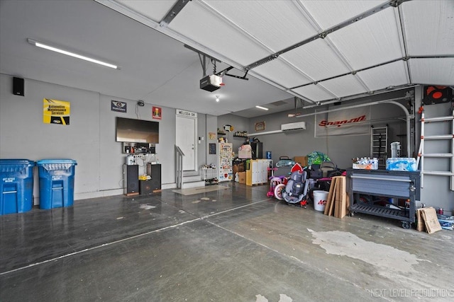 2267 Lundquist Dr, Aurora, IL 60503 - garage featuring a garage door opener and a wall mounted AC
