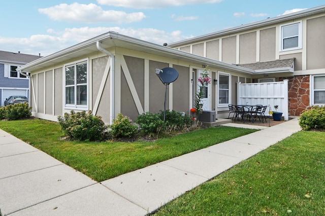 226 Nantucket Hbr Unit 226, Schaumburg, IL 60193 - view of side of property featuring stucco siding, board and batten siding, and a patio
