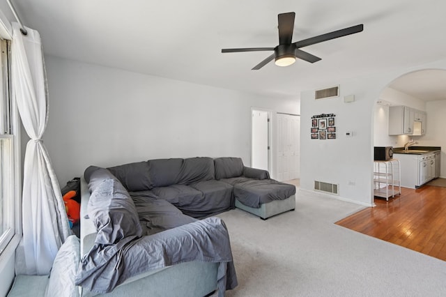 226 Nantucket Hbr Unit 226, Schaumburg, IL 60193 - living area featuring arched walkways, a ceiling fan, and light carpet