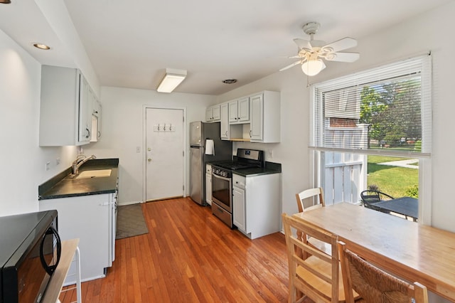 226 Nantucket Hbr Unit 226, Schaumburg, IL 60193 - kitchen with stainless steel appliances, dark countertops, healthy amount of natural light, and ceiling fan