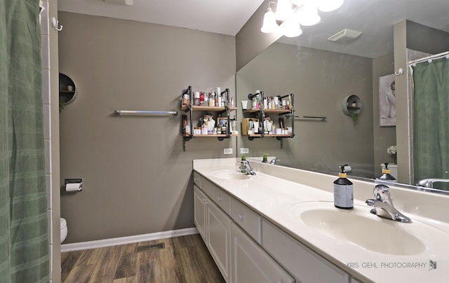 1115 E Fox Chase Dr, Round Lake Beach, IL 60073 - full bathroom featuring wood finished floors, double vanity, and a shower with curtain