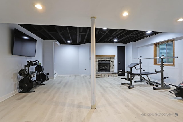 1115 E Fox Chase Dr, Round Lake Beach, IL 60073 - workout room with wood finished floors, a stone fireplace, and recessed lighting