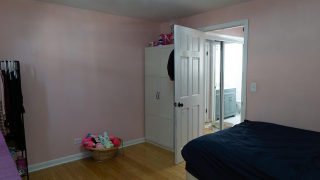 5704 W Montrose Ave Unit 2B, Chicago, IL 60634 - bedroom with light wood finished floors and baseboards