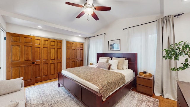 11649 S Walnut Ridge Dr, Palos Park, IL 60464 - bedroom with vaulted ceiling, light wood-style flooring, multiple closets, recessed lighting, and a ceiling fan