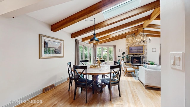 11649 S Walnut Ridge Dr, Palos Park, IL 60464 - dining space featuring a fireplace and light wood-style flooring