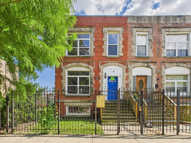 2933 W Wilcox St, Chicago, IL 60612 - multi unit property featuring a fenced front yard and brick siding