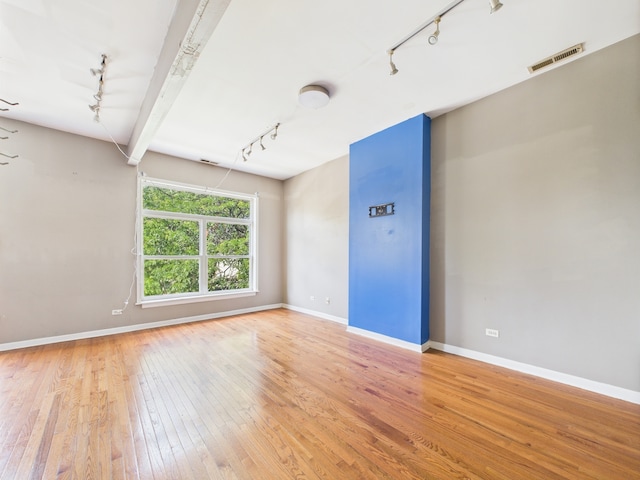 2933 W Wilcox St, Chicago, IL 60612 - unfurnished room featuring track lighting and wood-type flooring