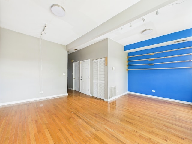 2933 W Wilcox St, Chicago, IL 60612 - empty room with rail lighting and light wood-type flooring
