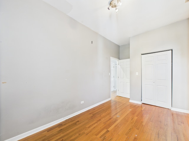 2933 W Wilcox St, Chicago, IL 60612 - unfurnished bedroom with light wood-style flooring and a closet
