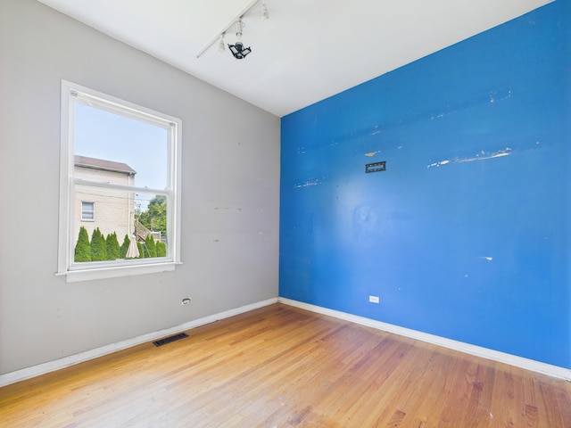2933 W Wilcox St, Chicago, IL 60612 - spare room with track lighting and light wood finished floors