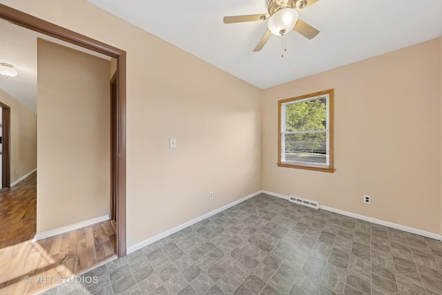 2140 Baker St, Aurora, IL 60506 - spare room featuring a ceiling fan and baseboards