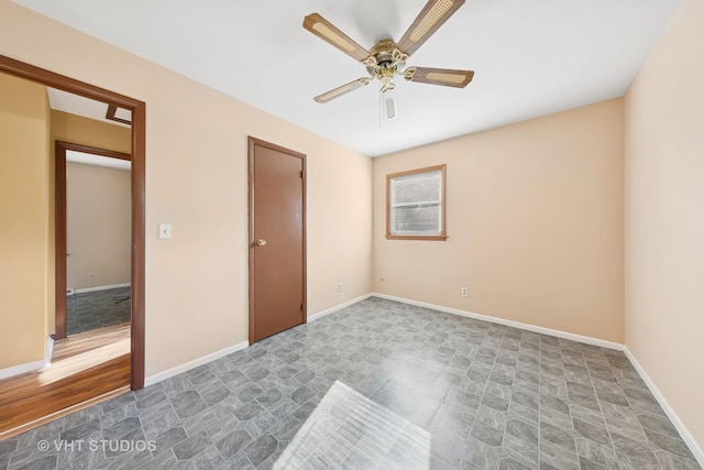 2140 Baker St, Aurora, IL 60506 - unfurnished bedroom with stone finish flooring and a ceiling fan