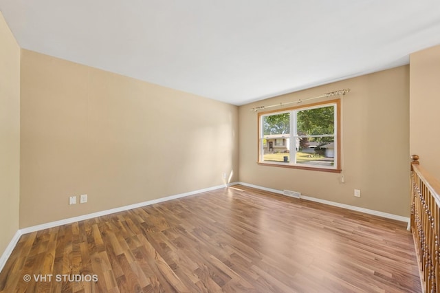 2140 Baker St, Aurora, IL 60506 - unfurnished room with wood finished floors and baseboards