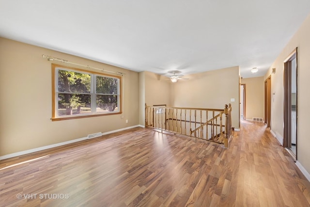 2140 Baker St, Aurora, IL 60506 - spare room featuring wood finished floors and ceiling fan