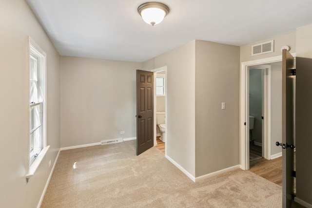 14348 Knox Ave, Midlothian, IL 60445 - unfurnished bedroom featuring light carpet and ensuite bath