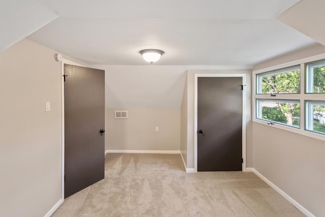 14348 Knox Ave, Midlothian, IL 60445 - unfurnished room with light carpet and lofted ceiling